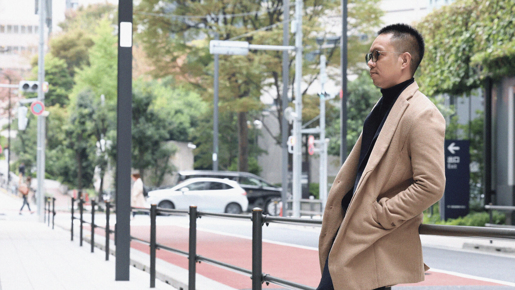 Erwin sitting on the railing, gazing into the distance